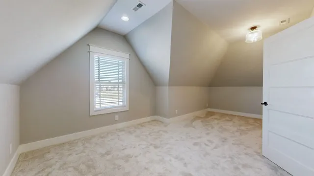 an empty room with a bathroom