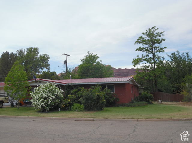 477 Grand Circle Moab, UT 84532 - Photo 2 of 22 View of side of property with metal roof