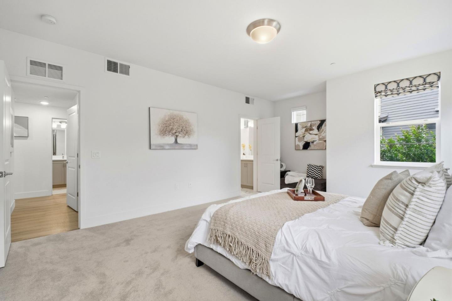 385 Line Street Hayward, CA 94544 - Photo 20 of 38 a spacious bedroom with a bed and a couch
