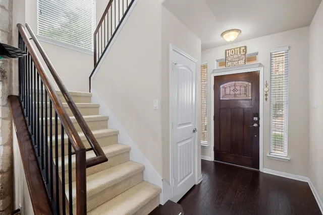 a kitchen with stainless steel appliances granite countertop a stove refrigerator sink and cabinets