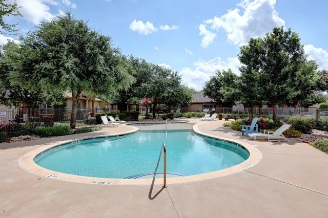 a view of a swimming pool with a sitting space