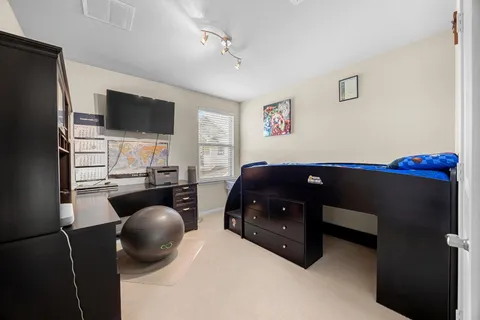 a bathroom with a granite countertop sink a mirror and a vanity