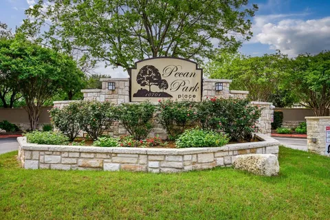 a view of a house with backyard porch and sitting area