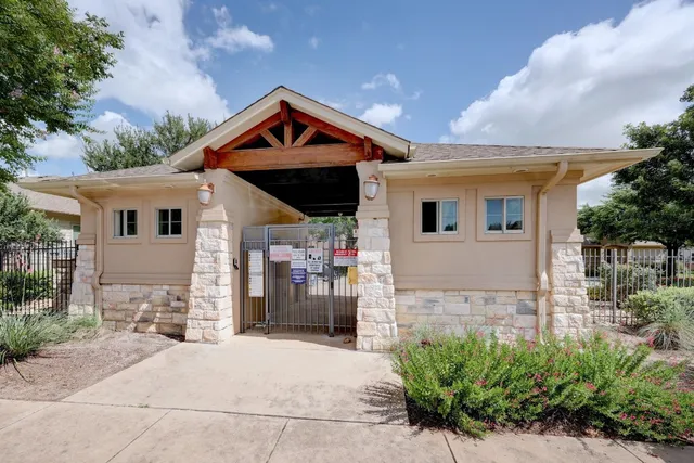 a view of a backyard with sitting area