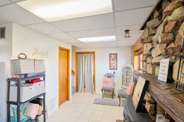 a bedroom with a bed and a television