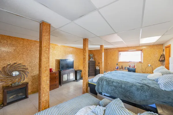 a living room with fireplace furniture and a flat screen tv