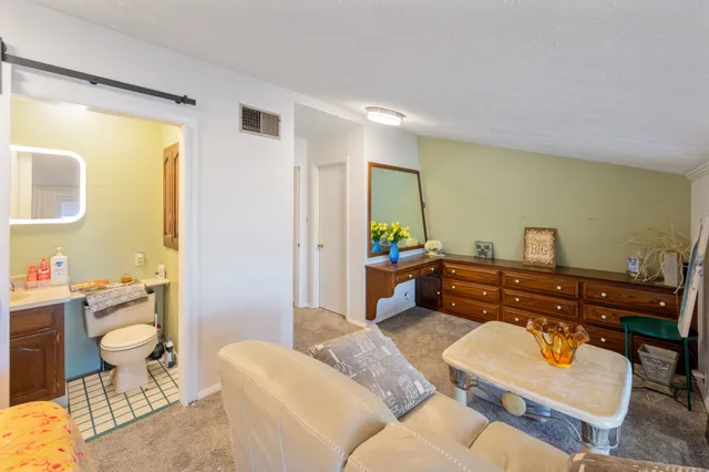 a bathroom with a sink vanity and a mirror