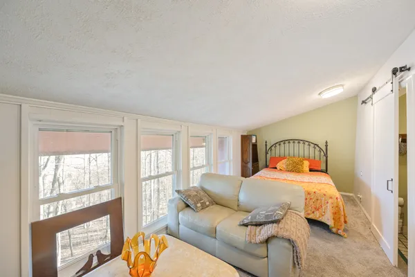 a bathroom with a sink mirror vanity and toilet