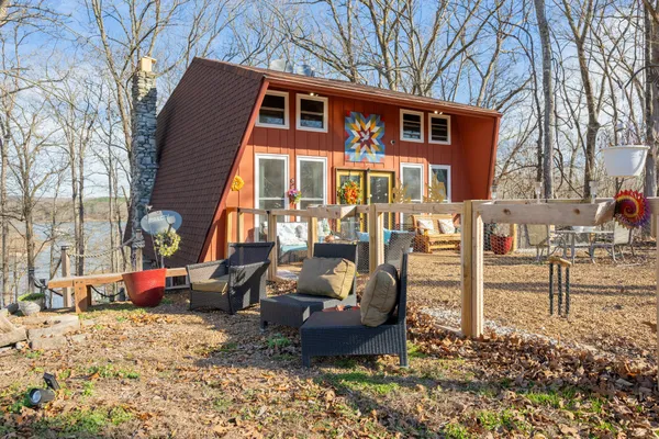 a front view of a building with lot of cars parked