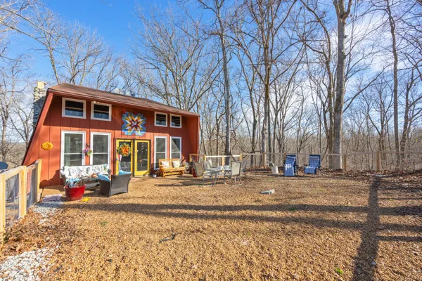 a view of trees and sky from a balcony