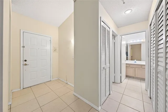 a bathroom with a sink a mirror and a shower