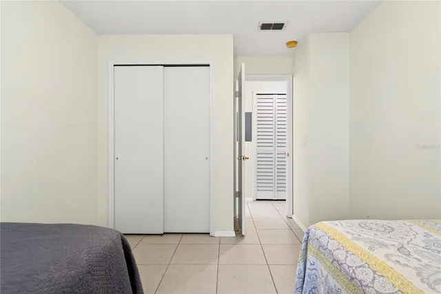 a bedroom with a bed and a shower