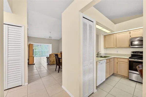 a kitchen with stainless steel appliances granite countertop a sink and cabinets