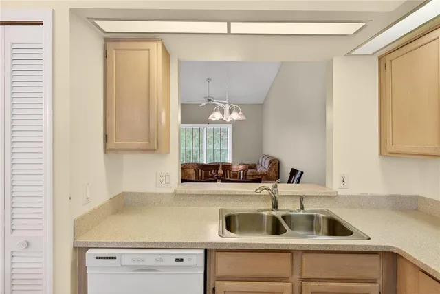 a kitchen with a sink and cabinets