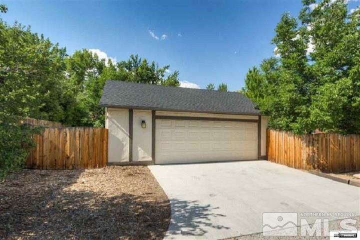 644 Marsh Avenue Reno, NV 89509 - Photo 8 of 19 a front view of a house with a yard and garage