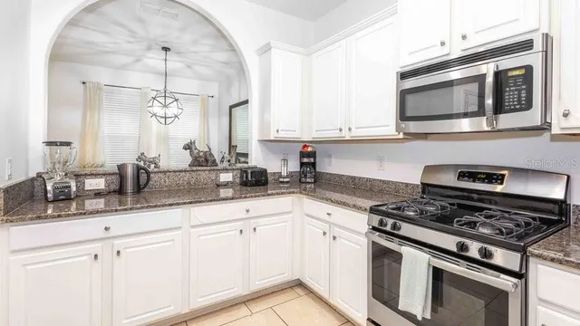 a bathroom with a toilet a sink and a mirror
