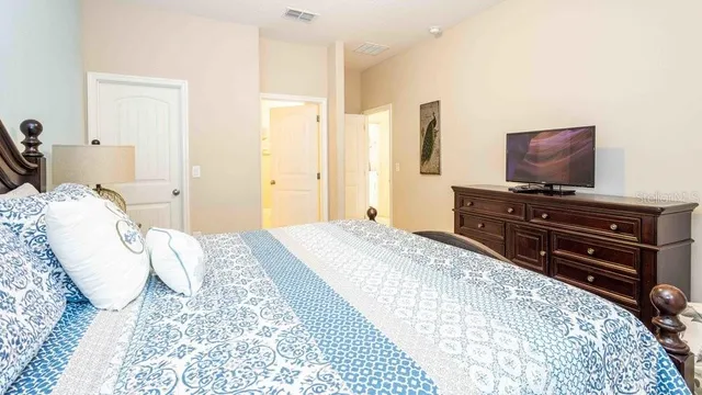 a bathroom with a sink a mirror and a picture on the wall