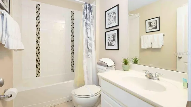 a bathroom with a toilet sink and tub