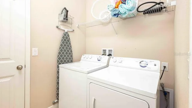 a view of a swimming pool with a patio