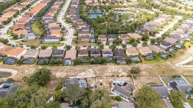 an aerial view of a residential apartment building with parking space