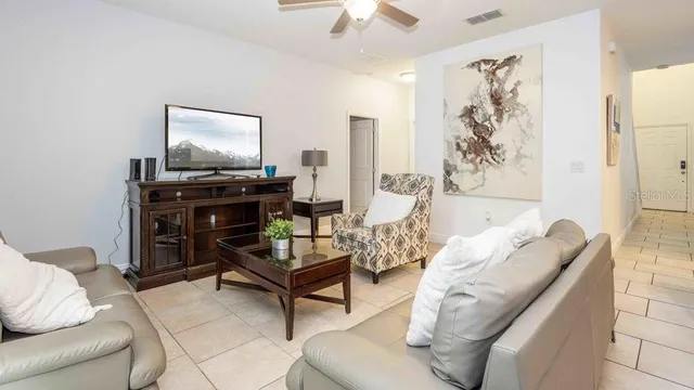a dining room with furniture and window