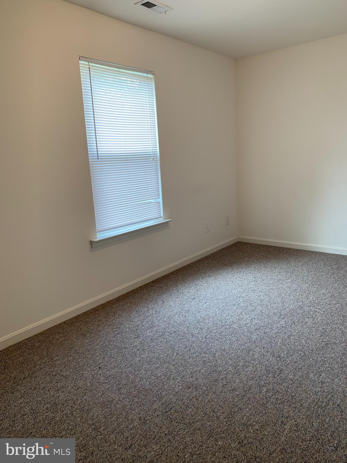 3916 6th Street, Unit B North Beach, MD 20714 - Photo 5 of 5 an empty room with a window