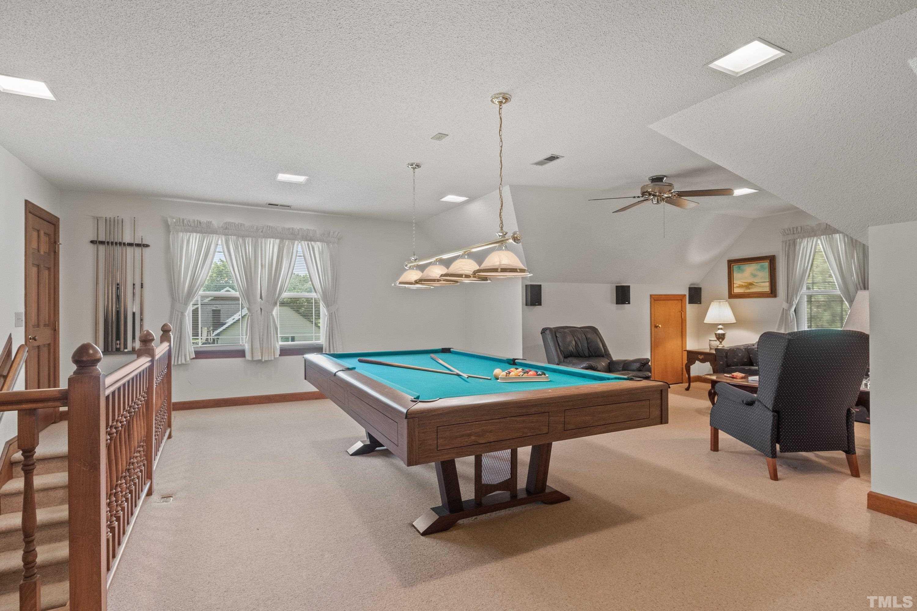 8501 Crowder Road Raleigh, NC 27603 - Photo 33 of 60 a living room with furniture a table and a fireplace