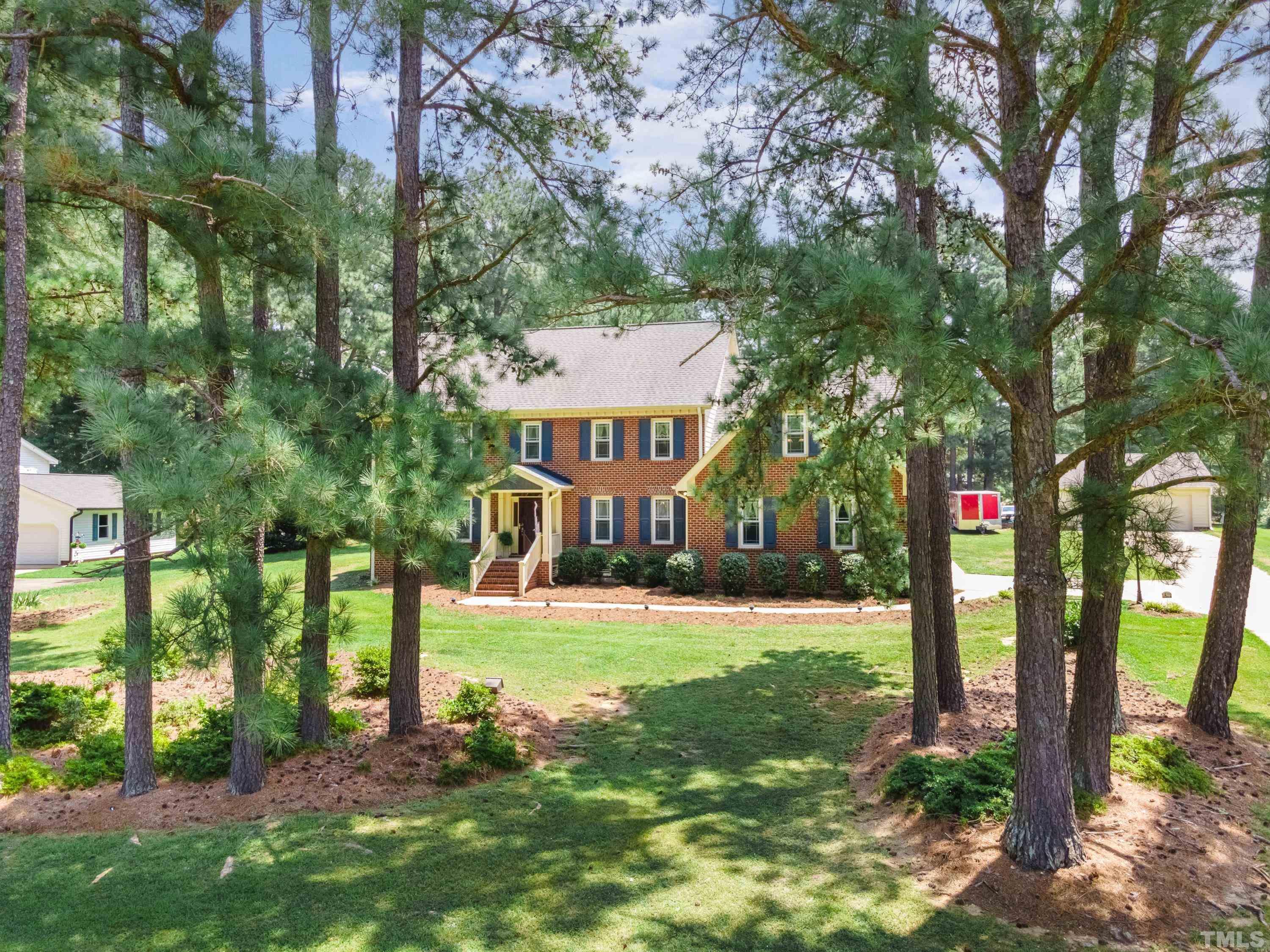 8501 Crowder Road Raleigh, NC 27603 - Photo 4 of 60 a view of a big yard with plants and large trees