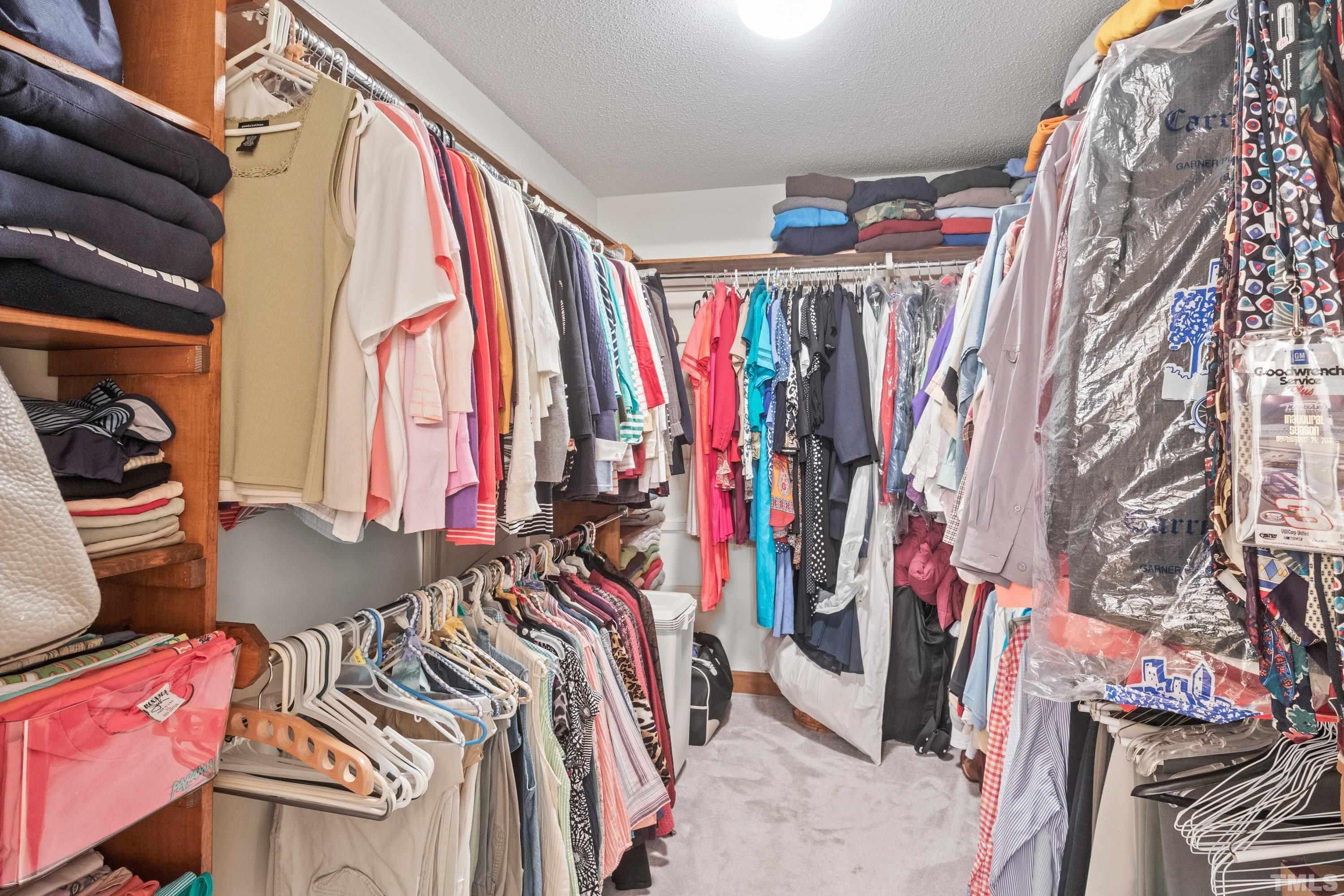 8501 Crowder Road Raleigh, NC 27603 - Photo 42 of 60 a view of walk in closet with clothes