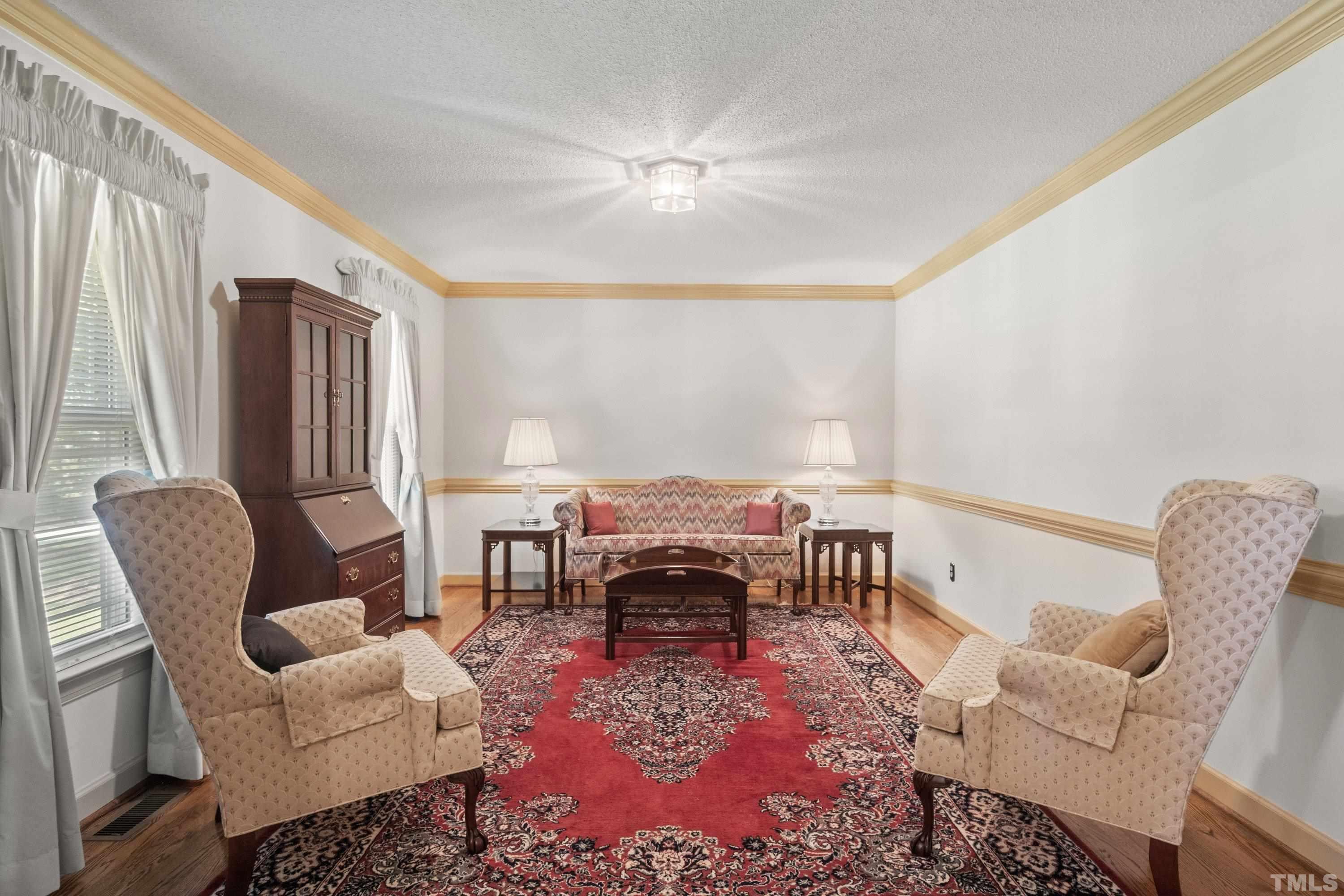 8501 Crowder Road Raleigh, NC 27603 - Photo 10 of 60 a living room with furniture rug and a large window