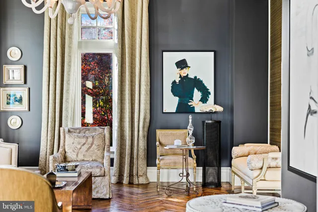 a view of living room with furniture and floor to ceiling window