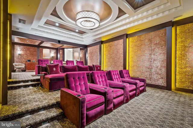 a living room with a couch and a chandelier