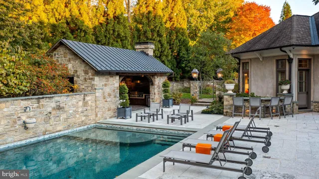 a view of a patio with table and chairs