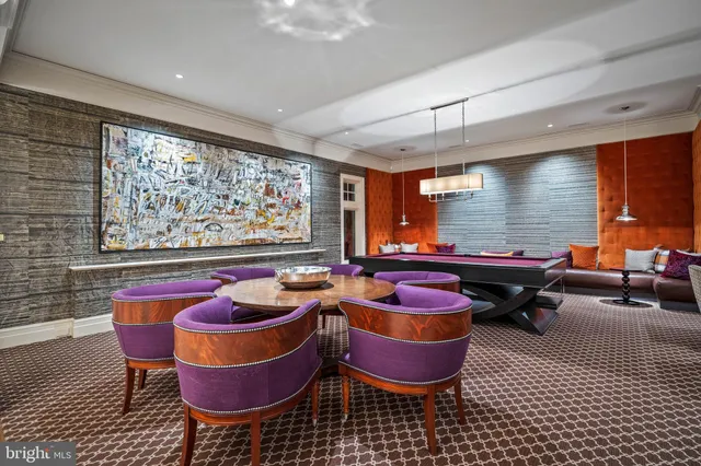 a living room with furniture kitchen view and a fireplace
