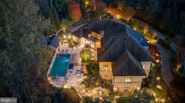 a outdoor space with patio couches and pool view