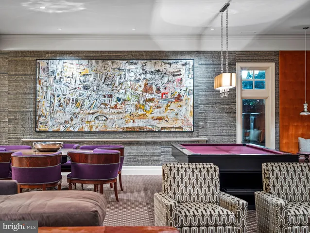 a living room with furniture a rug and a large window