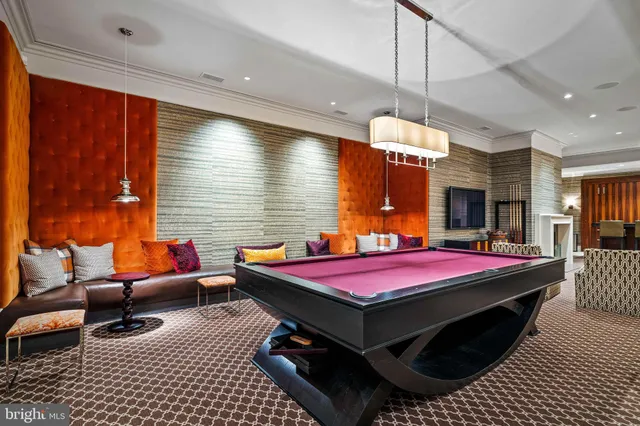 a living room with fireplace furniture and a window