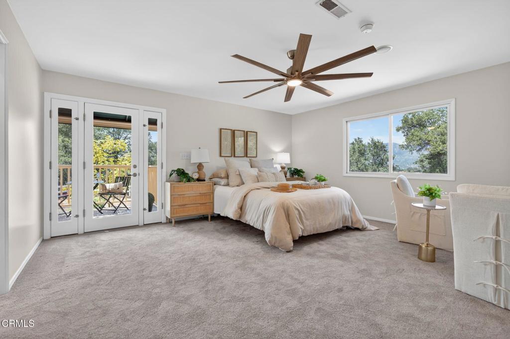 98 Howard Avenue Oak View, CA 93022 - Photo 23 of 72 a spacious bedroom with a bed and a large window