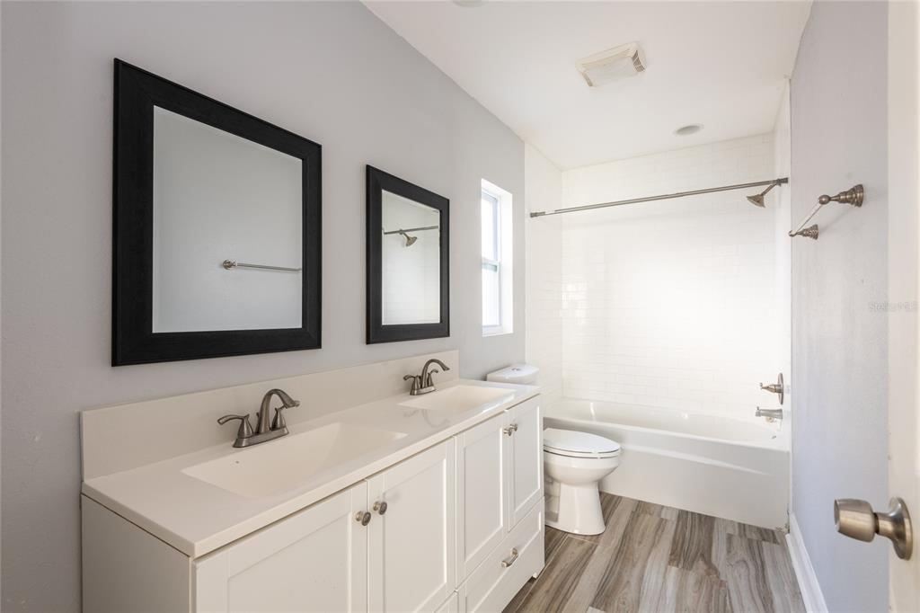 12417 84th Way Largo, FL 33773 - Photo 13 of 27 a bathroom with a sink and a mirror