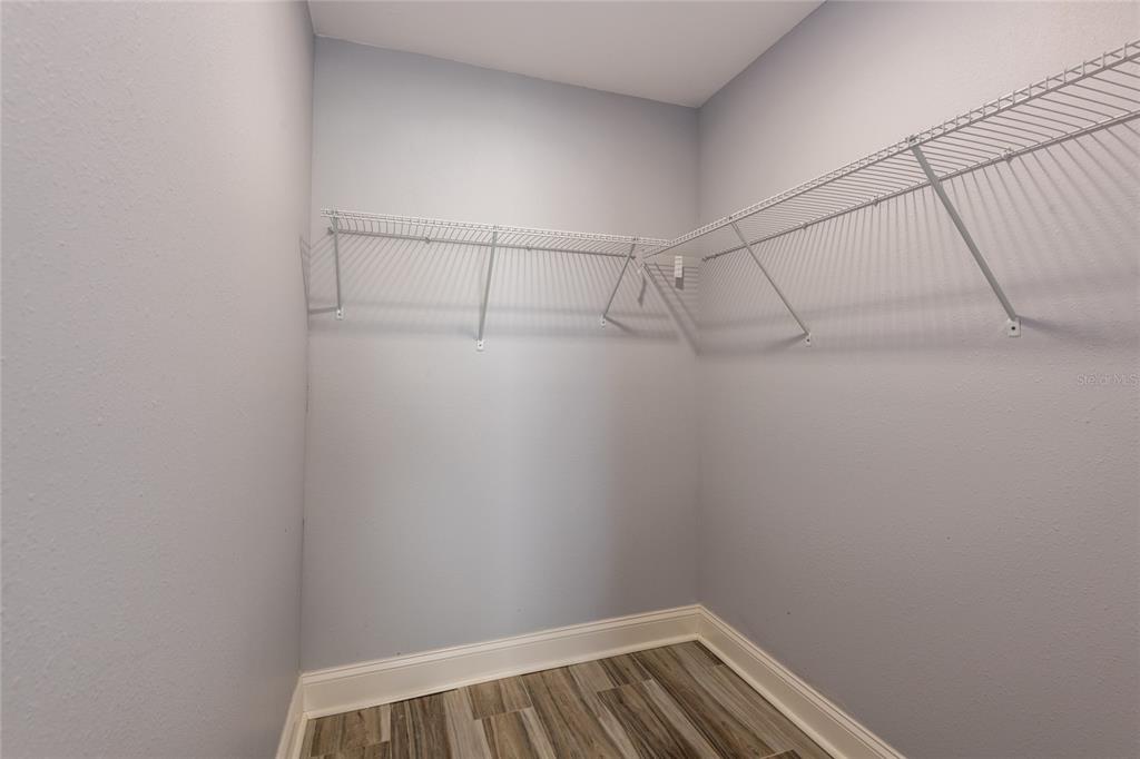 12417 84th Way Largo, FL 33773 - Photo 14 of 27 a view of small space with racks on the wall