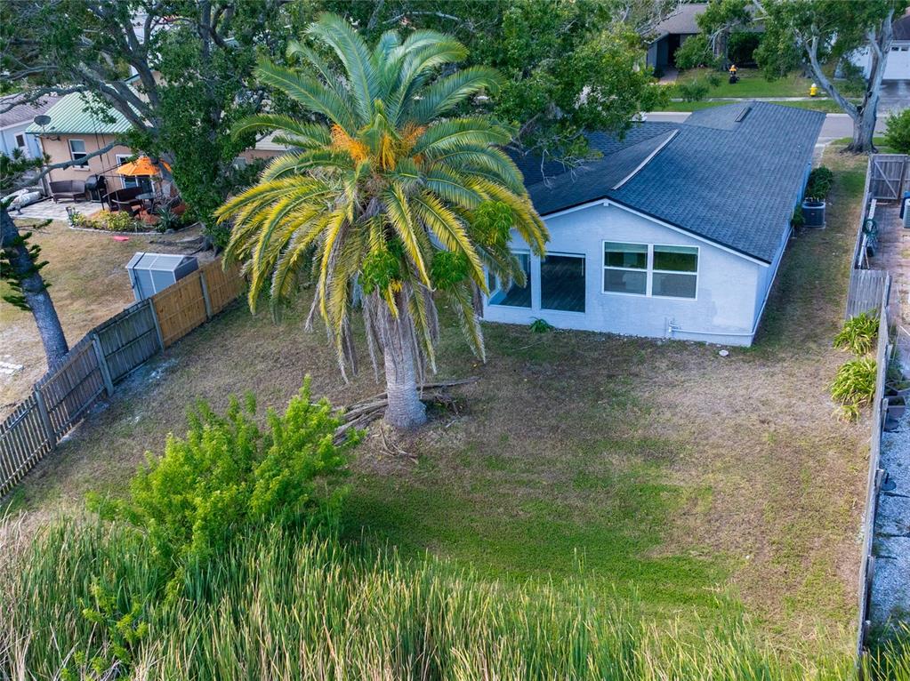 12417 84th Way Largo, FL 33773 - Photo 22 of 27 a front view of a house with a yard