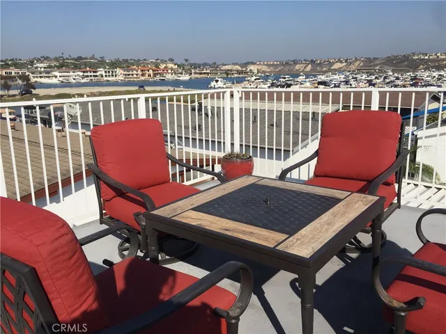a view of a balcony with chairs