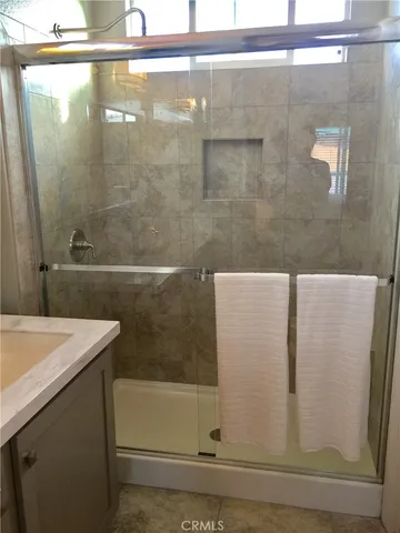 a bathroom with a bathtub and a shower