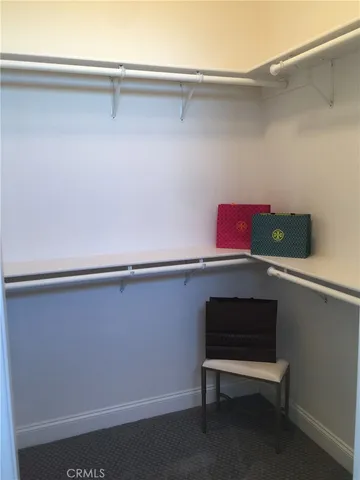 a view of a room with racks on the wall