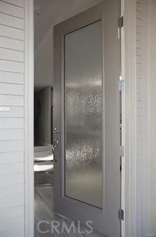 a bathroom with a glass shower door