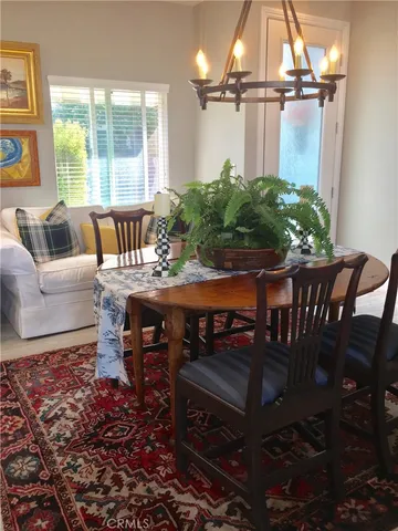 a dining room with furniture and window
