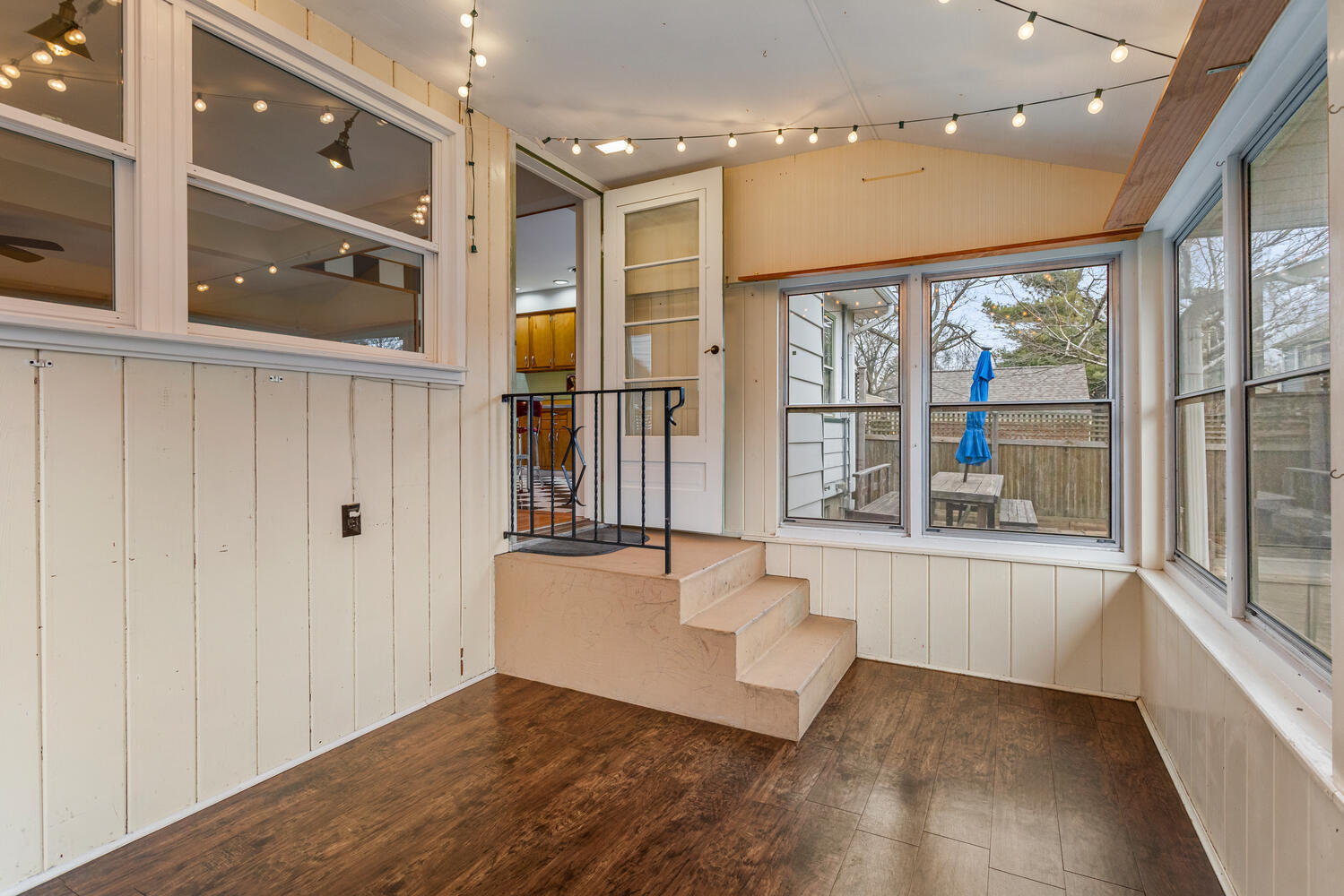 1111 West John Street Champaign, IL 61821 - Photo 11 of 39 a view of an entryway with wooden floor