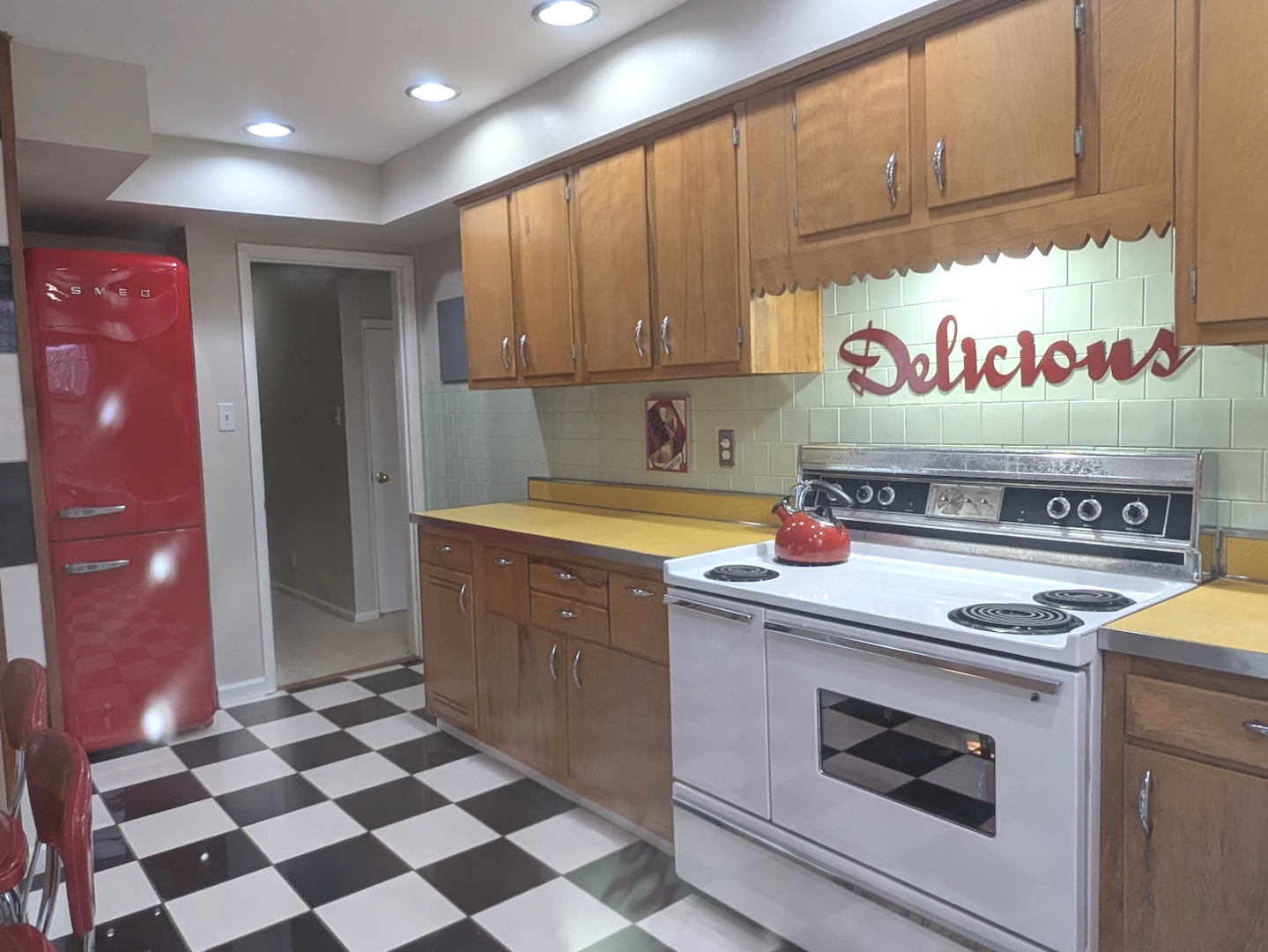 1111 West John Street Champaign, IL 61821 - Photo 13 of 39 a kitchen with a sink and cabinets