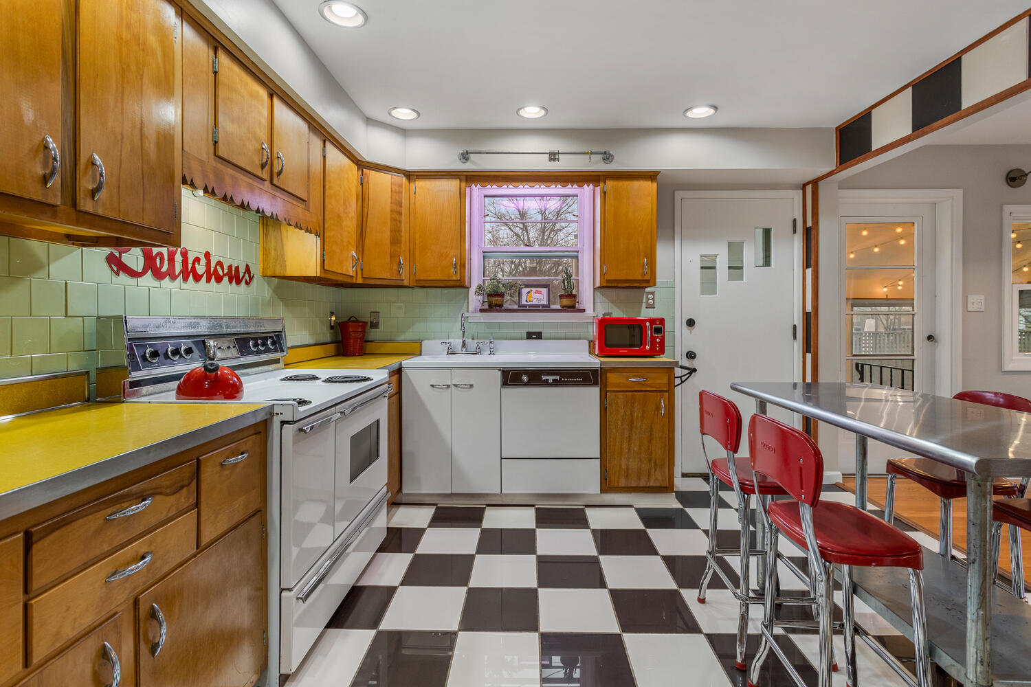 1111 West John Street Champaign, IL 61821 - Photo 14 of 39 a kitchen with a sink stove and cabinets
