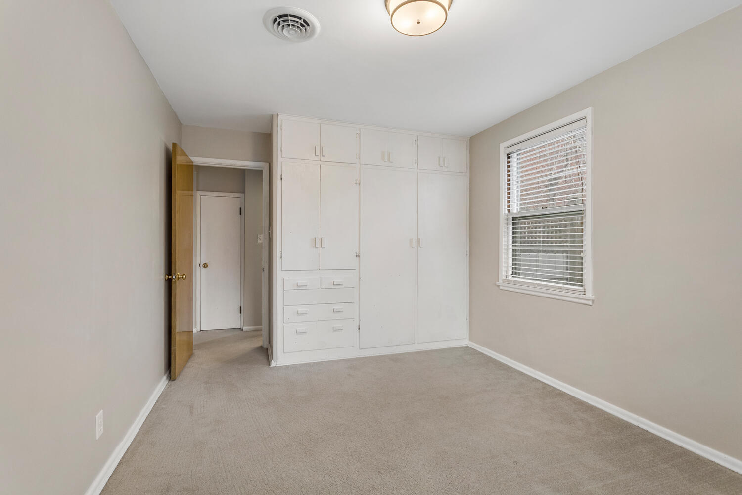 1111 West John Street Champaign, IL 61821 - Photo 17 of 39 an empty room with windows